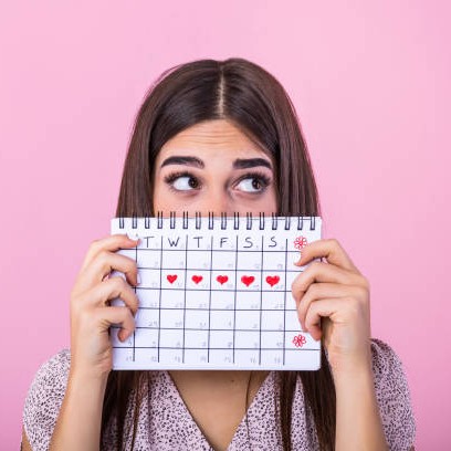 10204084081078-woman-holding-period-calendar-17439799034997.jpg