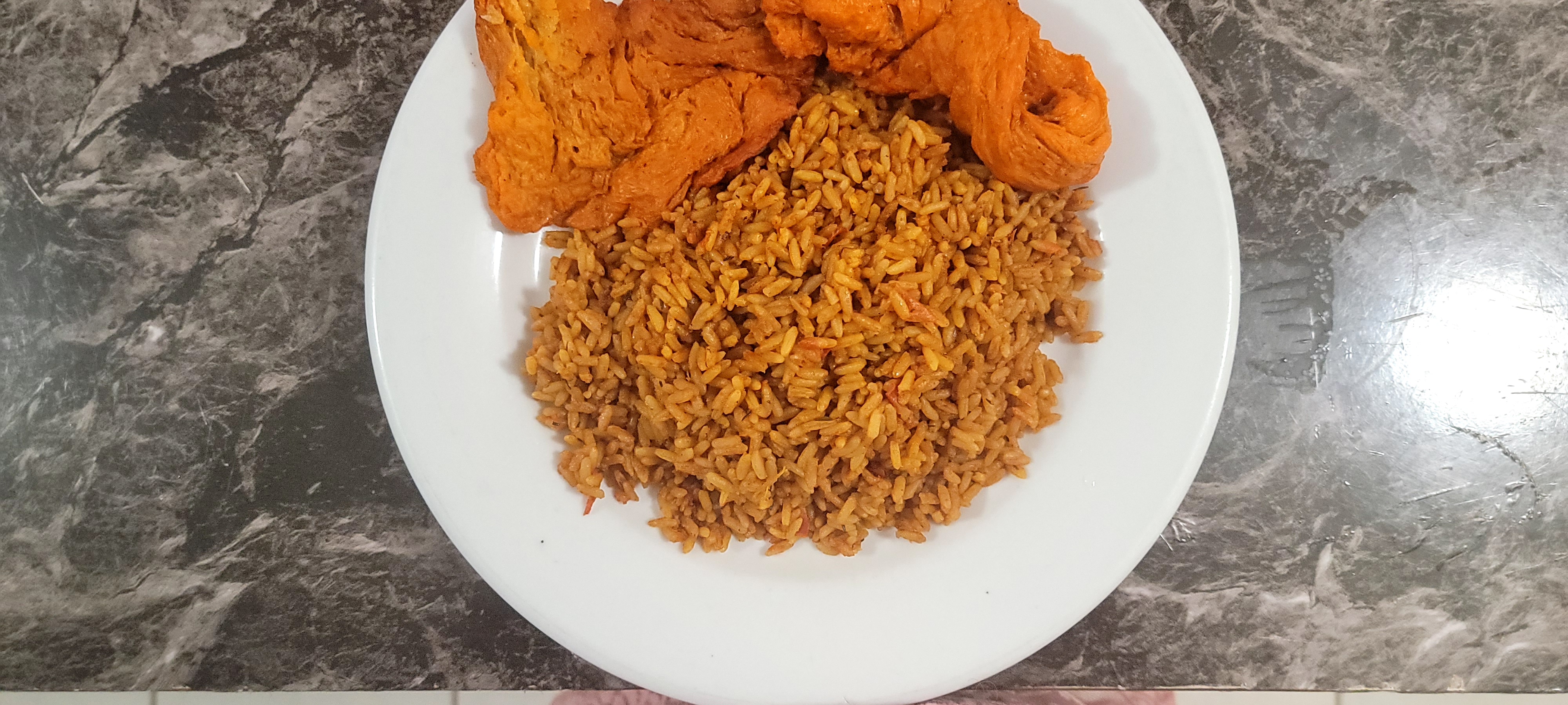 Jollof Rice paired with our meatless bbq pork 