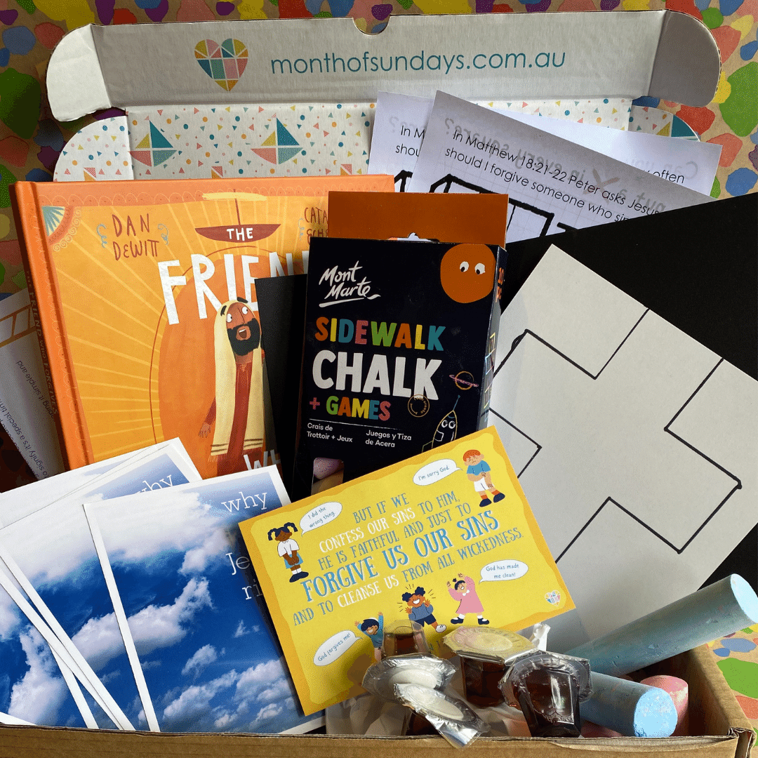 Open subscription box with colourful bible craft and activities featuring Christian kids book The Friend who forgives. 