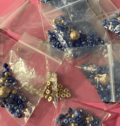 068467490227-bags-of-blue-beads-1690452187249.png