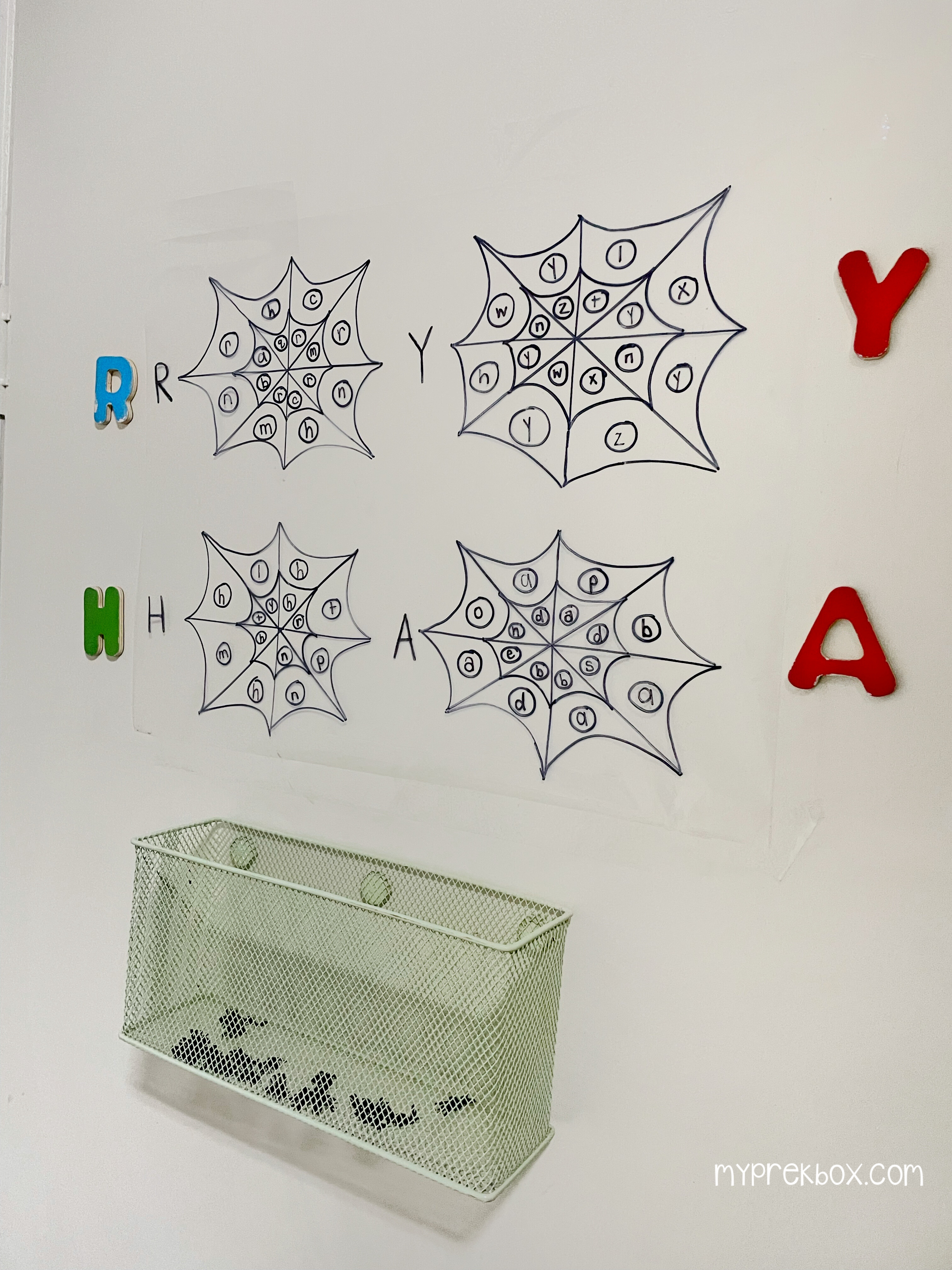 preschool halloween letter recognition activity: 4 letters and 4 spider webs