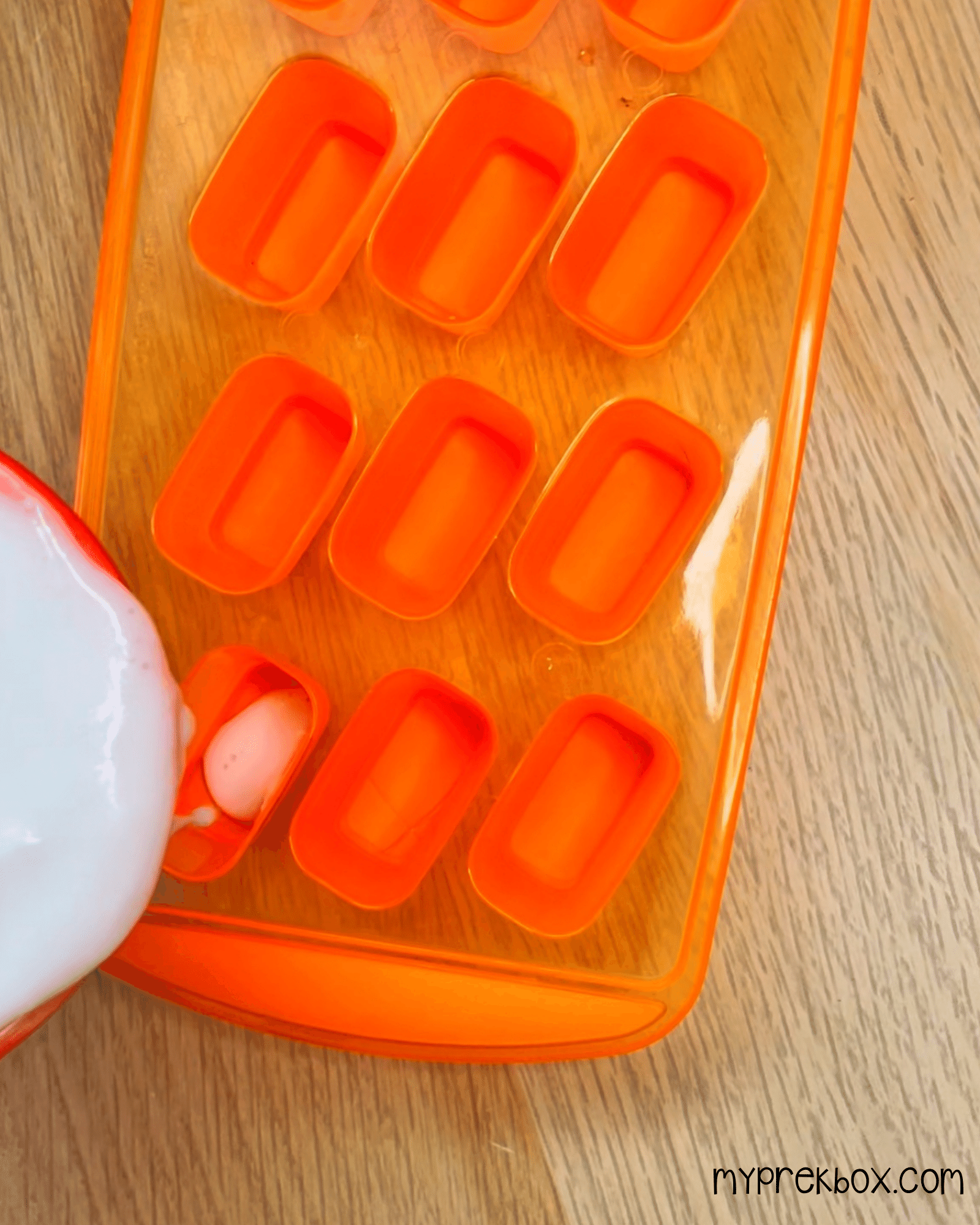 pouring mixture into ice cube trays