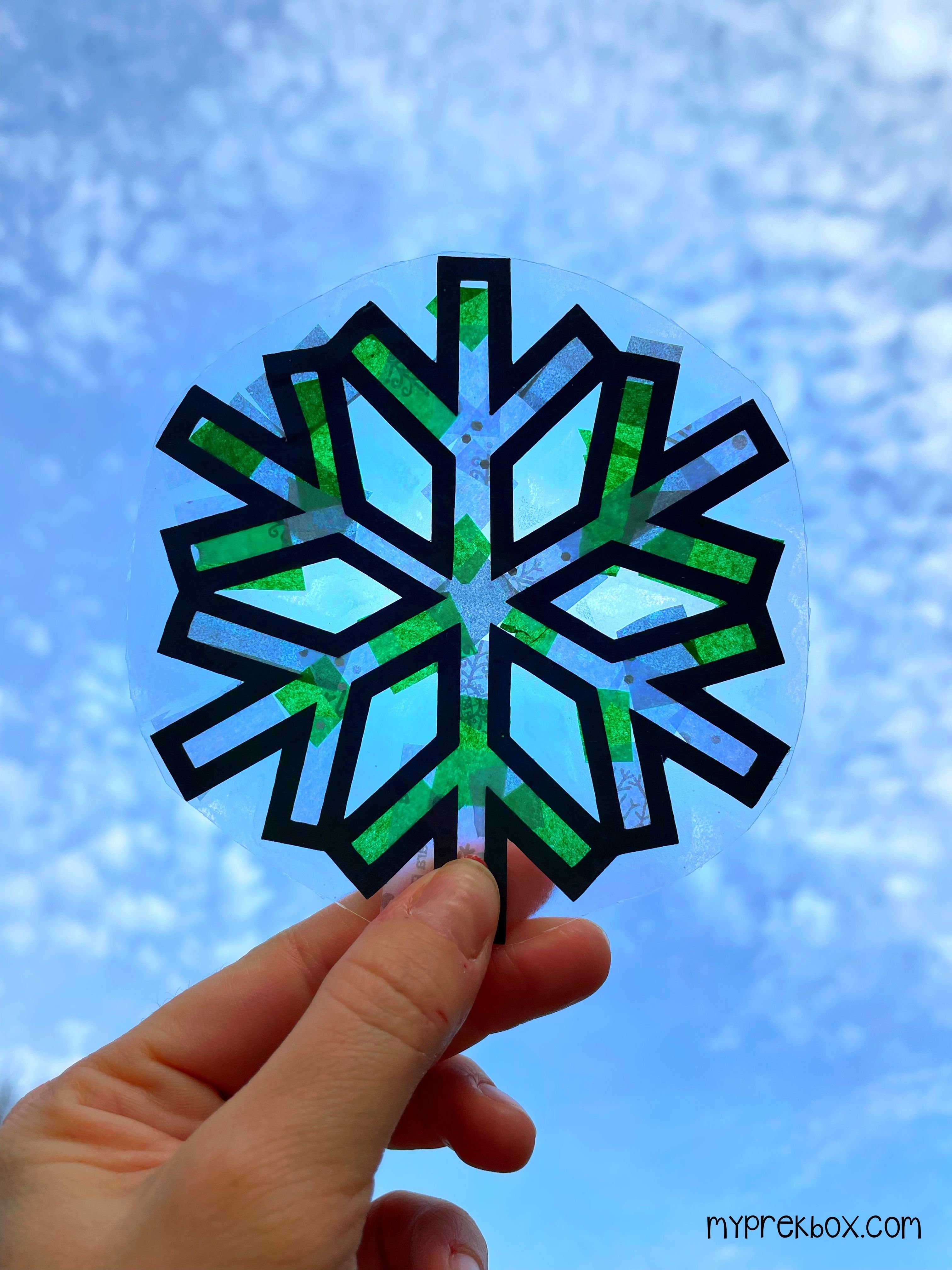green and white snowflake in the sun