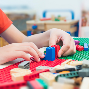 kid playing lego fine motor development