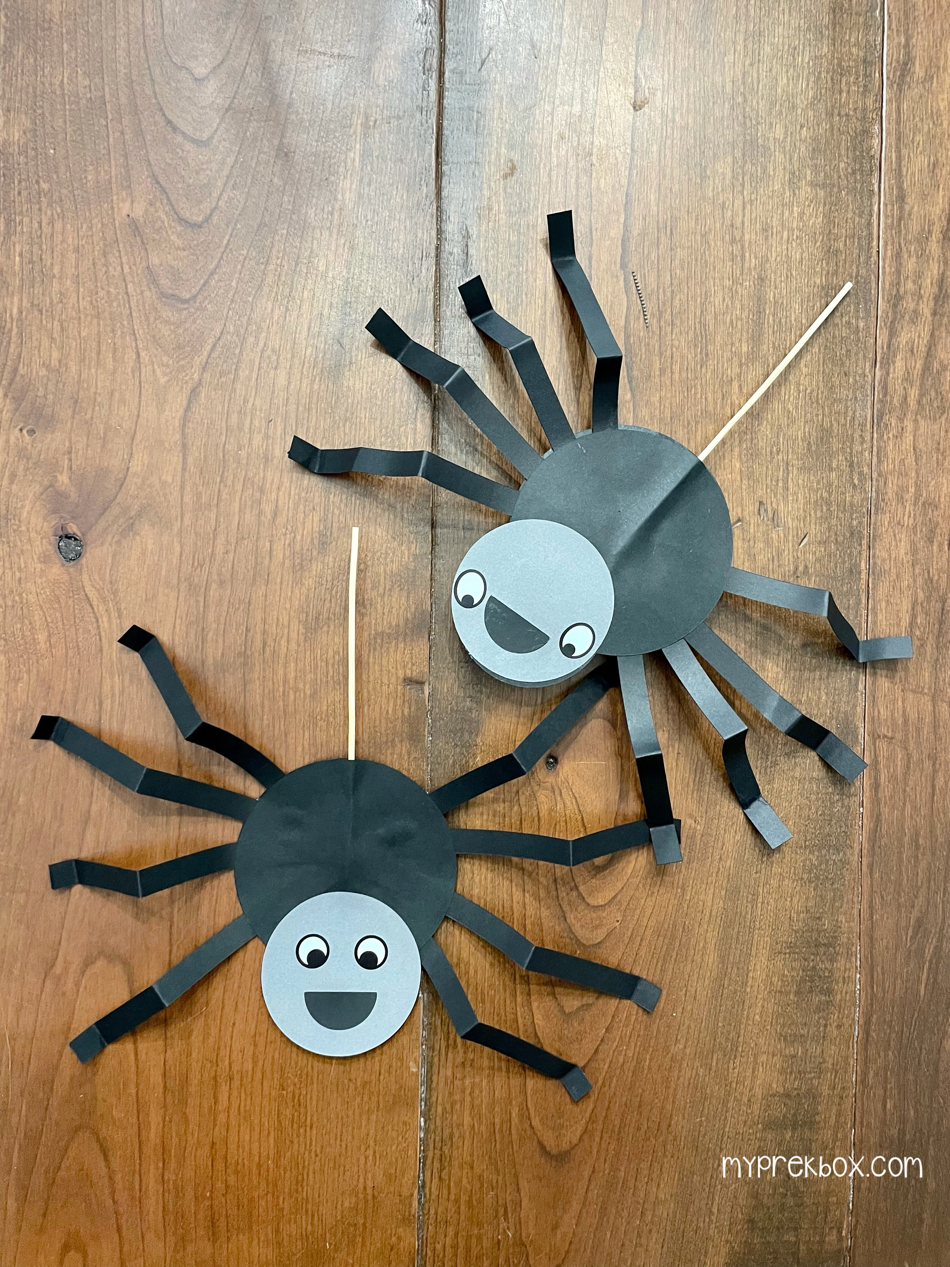 spider craft, two crafty spiders on a table