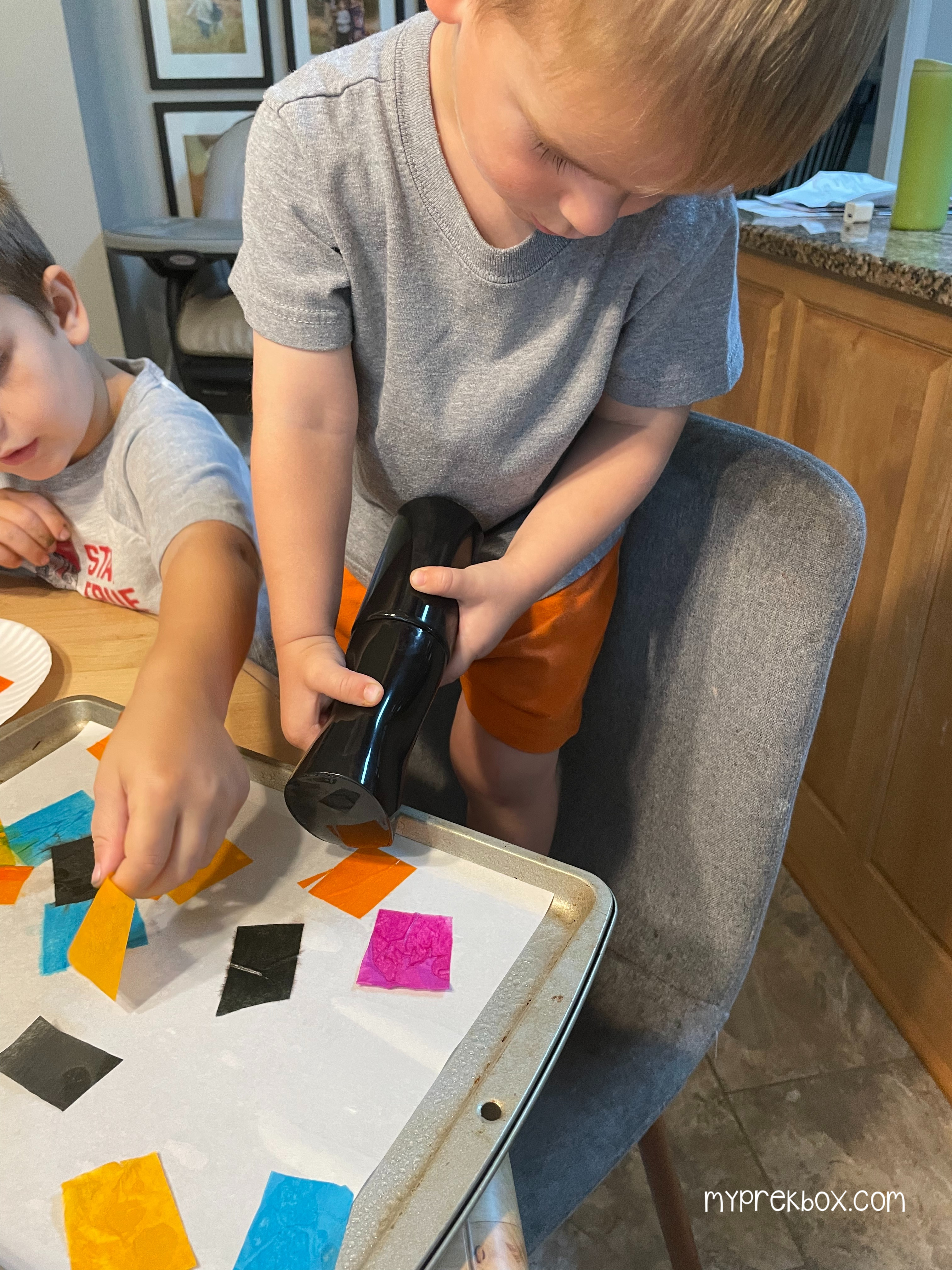 spooky silhouettes, kid spraying paper with spray bottle