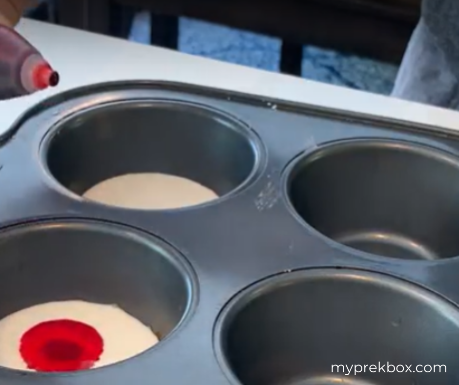 adding food color to chalk paint in muffin tin