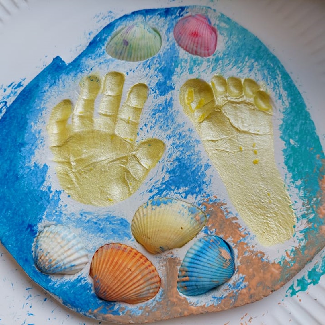 beach themed hand and footprint keepsake using air dry clay and shells