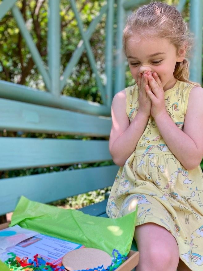 happy child receives their box