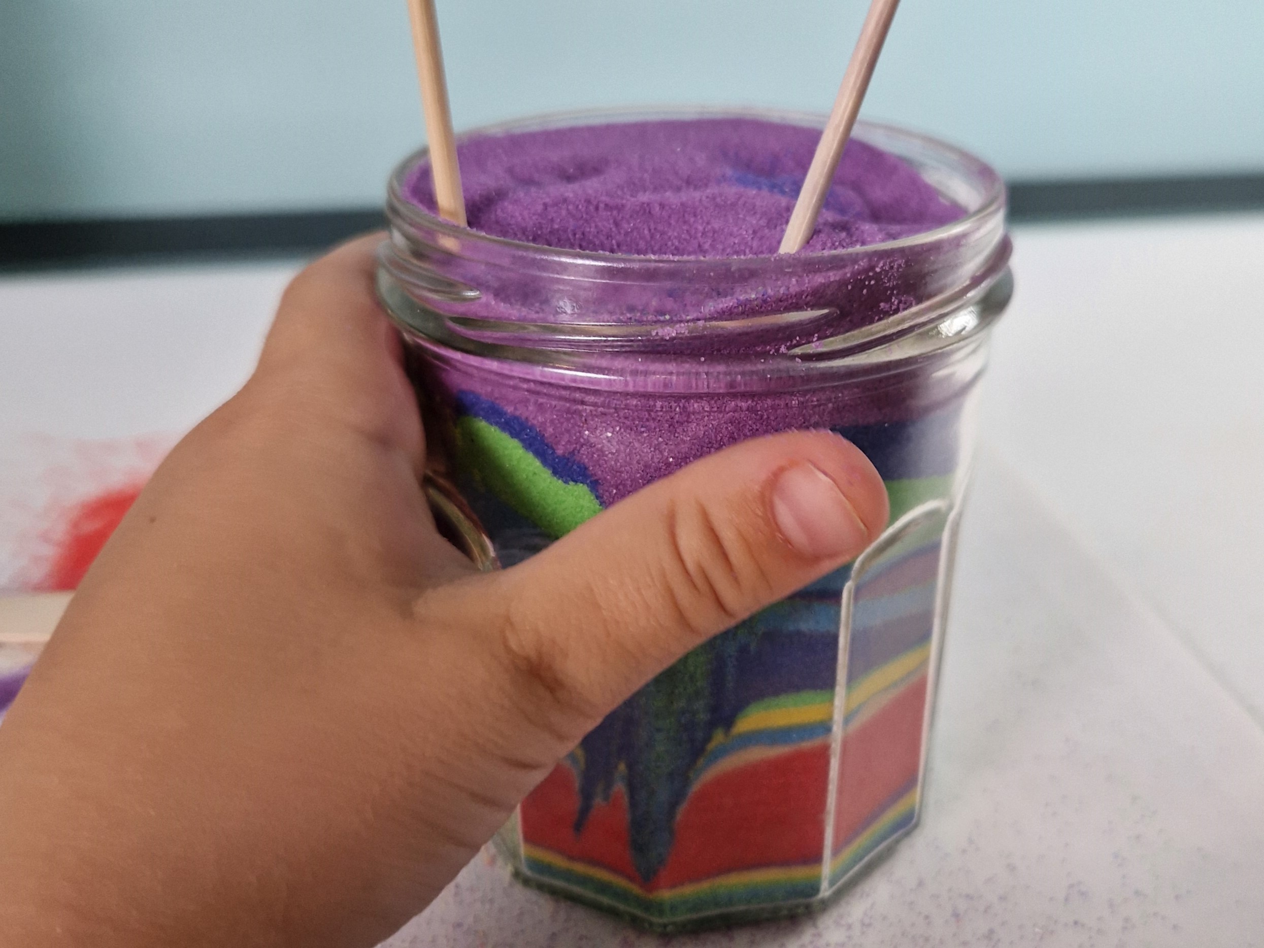 use bamboo skewers to create patterns in your sand art jar