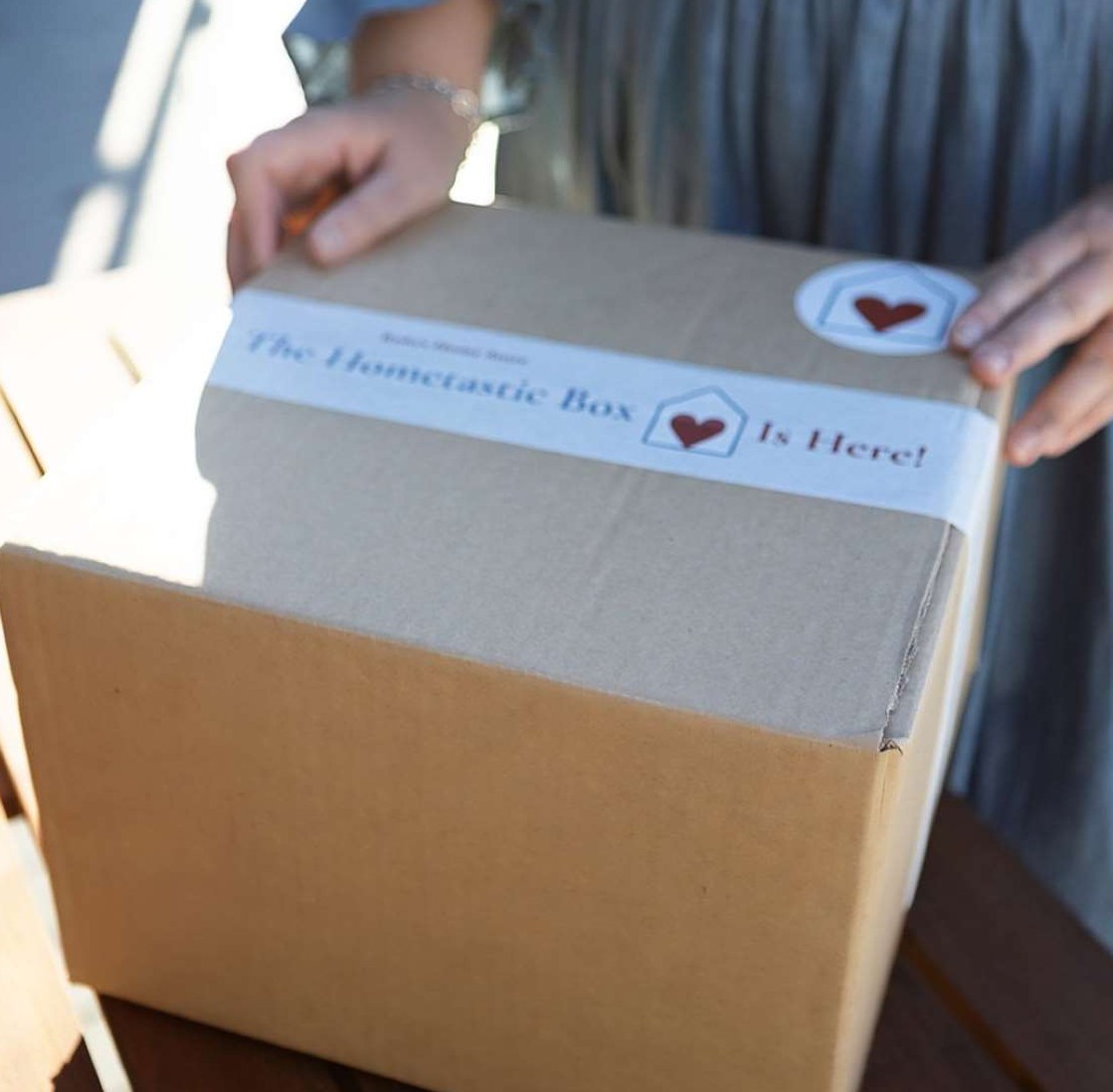 3851111910981120-jane-holding-the-hometastic-box-17021080282142.jpg