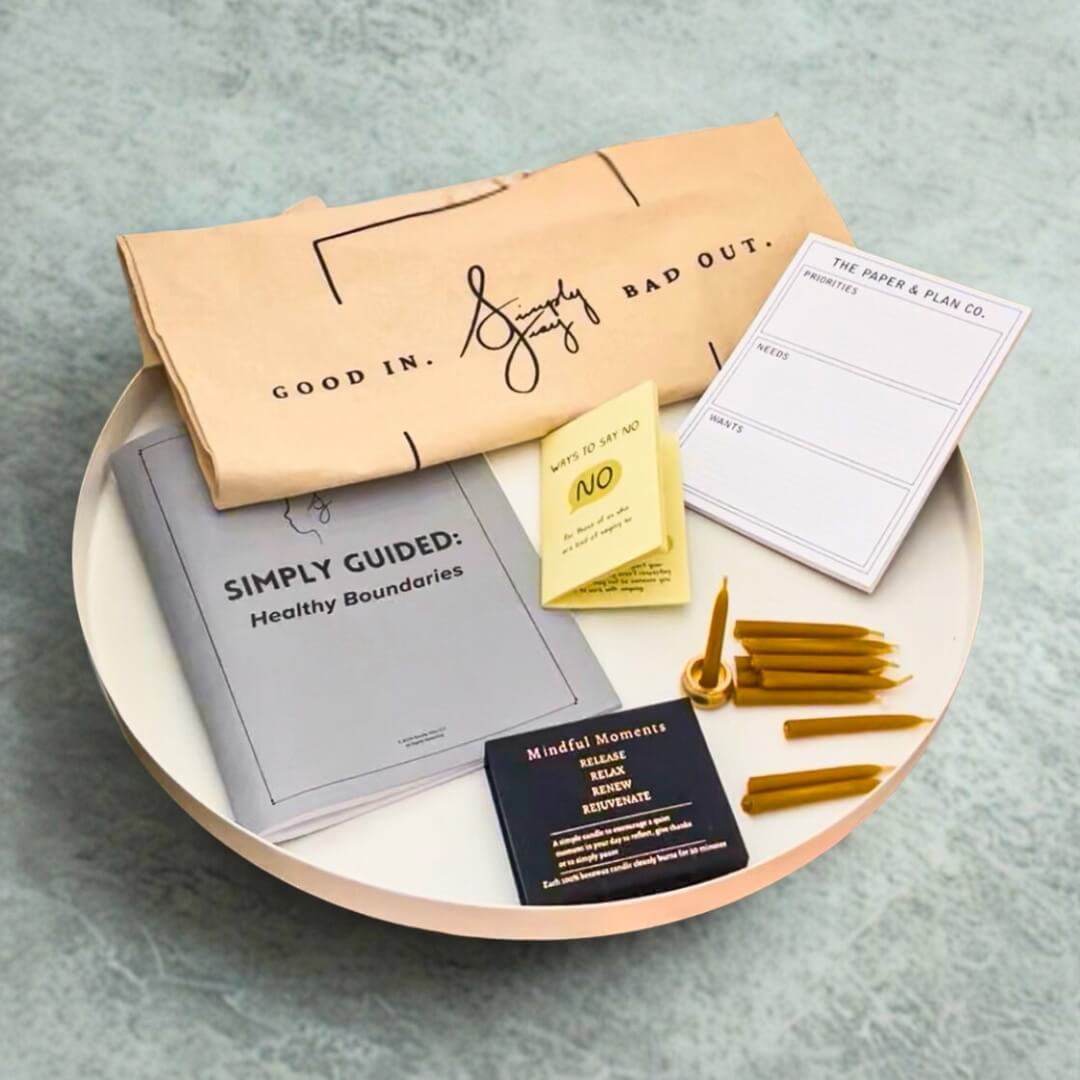 Healthy Boundaries mental wellness tools including a guidebook, candles, tote bag, and planner pad from the Simply Gray subscription box.