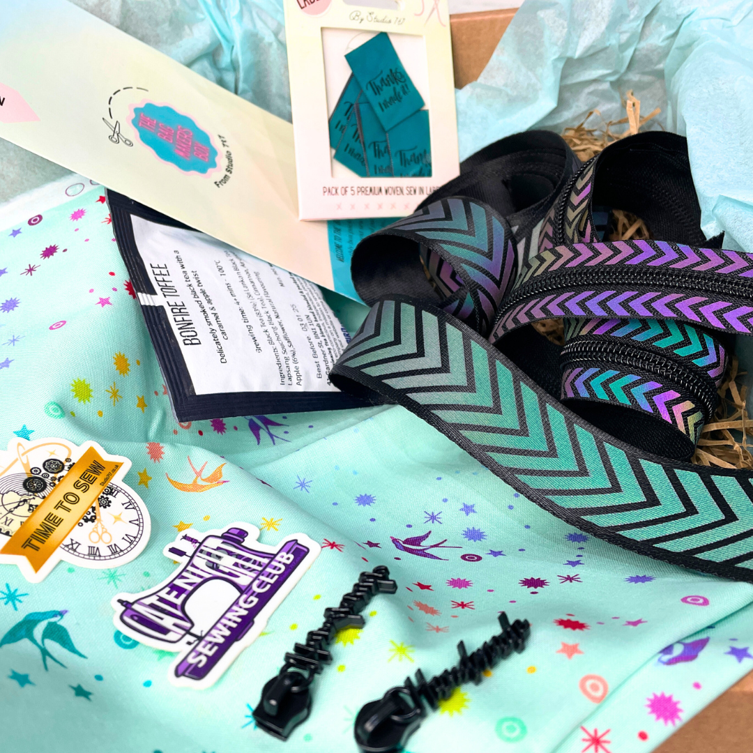 Bag Maker’s Box with teal fabric, chevron webbing, Bird & Blend tea, and fun sewing stickers.