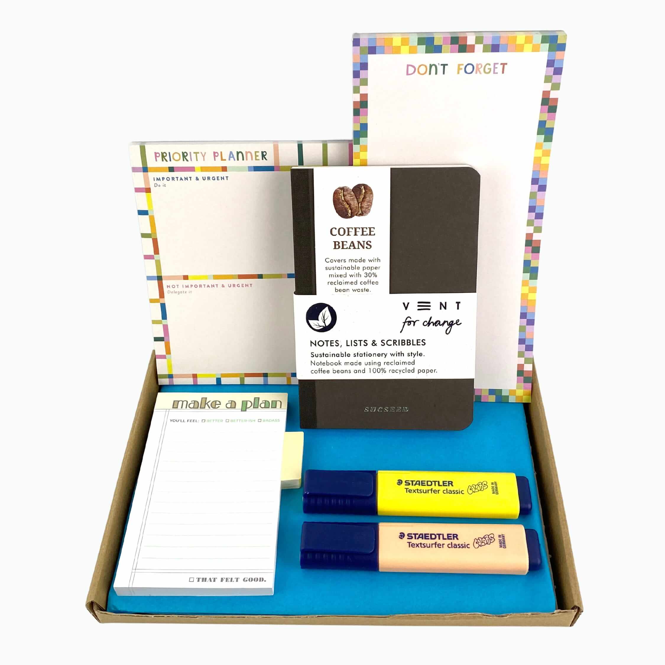 List pad, planner, notebook, sticky notes and highlighters in a letterbox friendly box