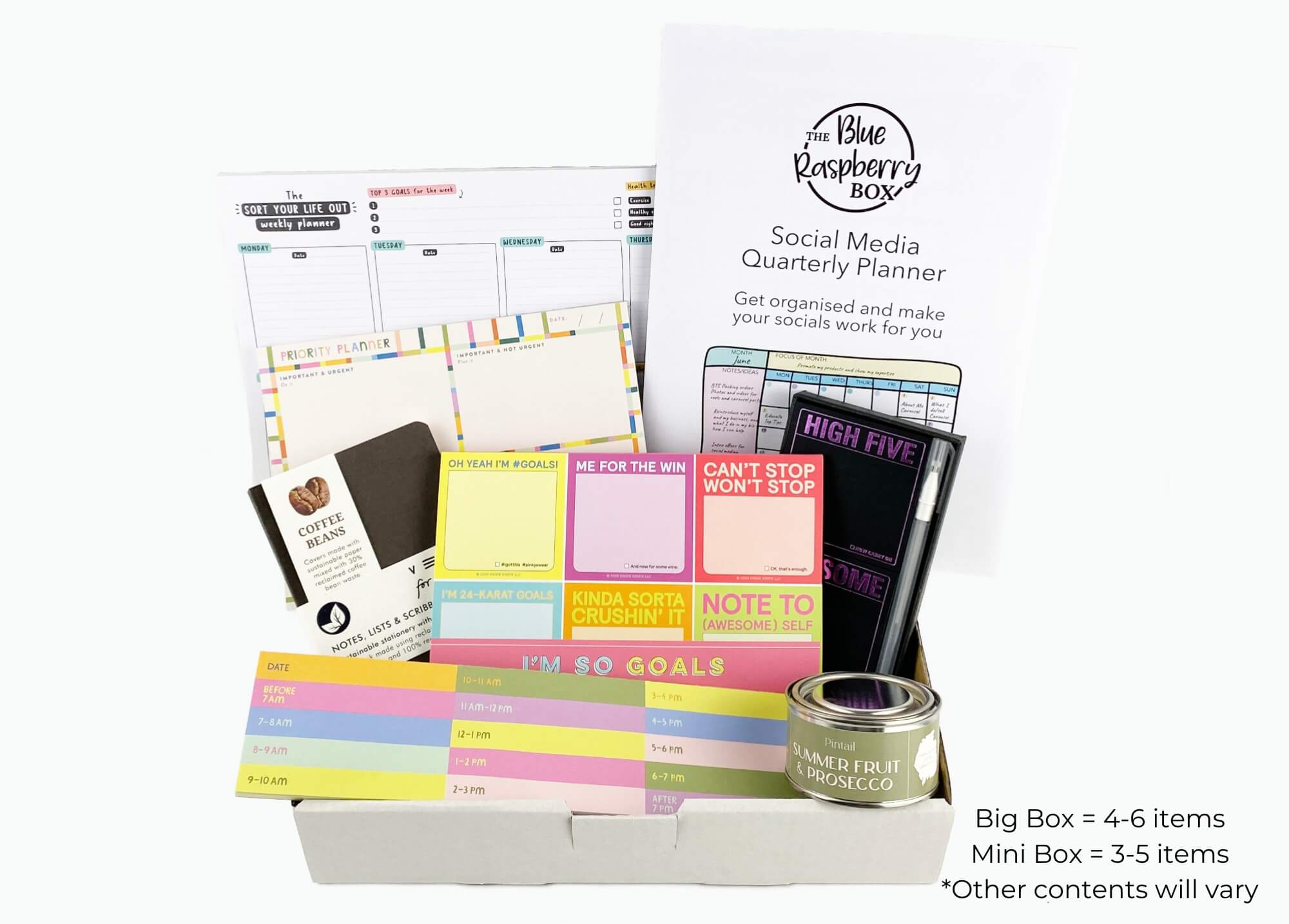 Bright and colourful sticky notes, list pads, notebooks and planners in a white box