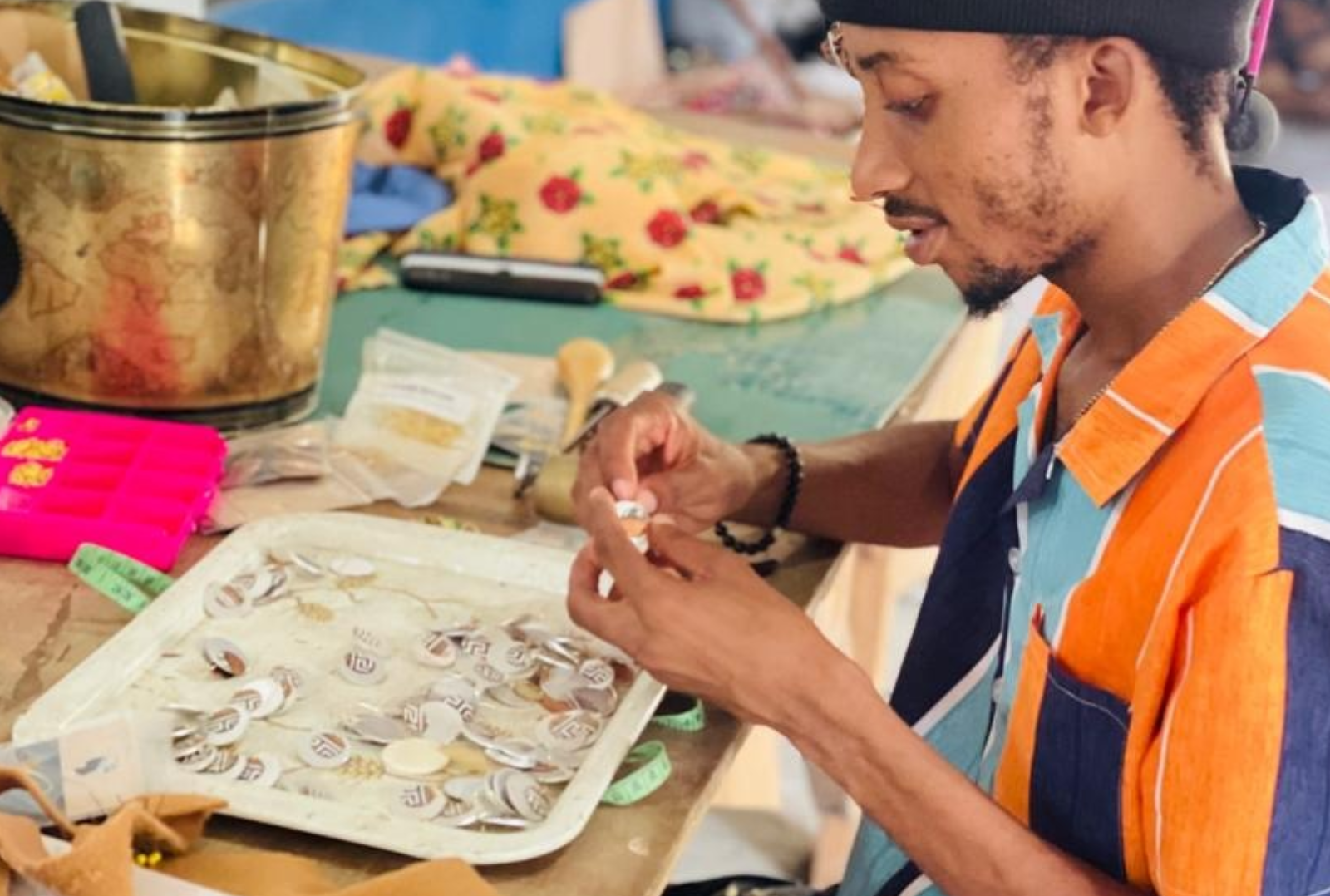 Jacky Making Earrings Haitian Man making earrings