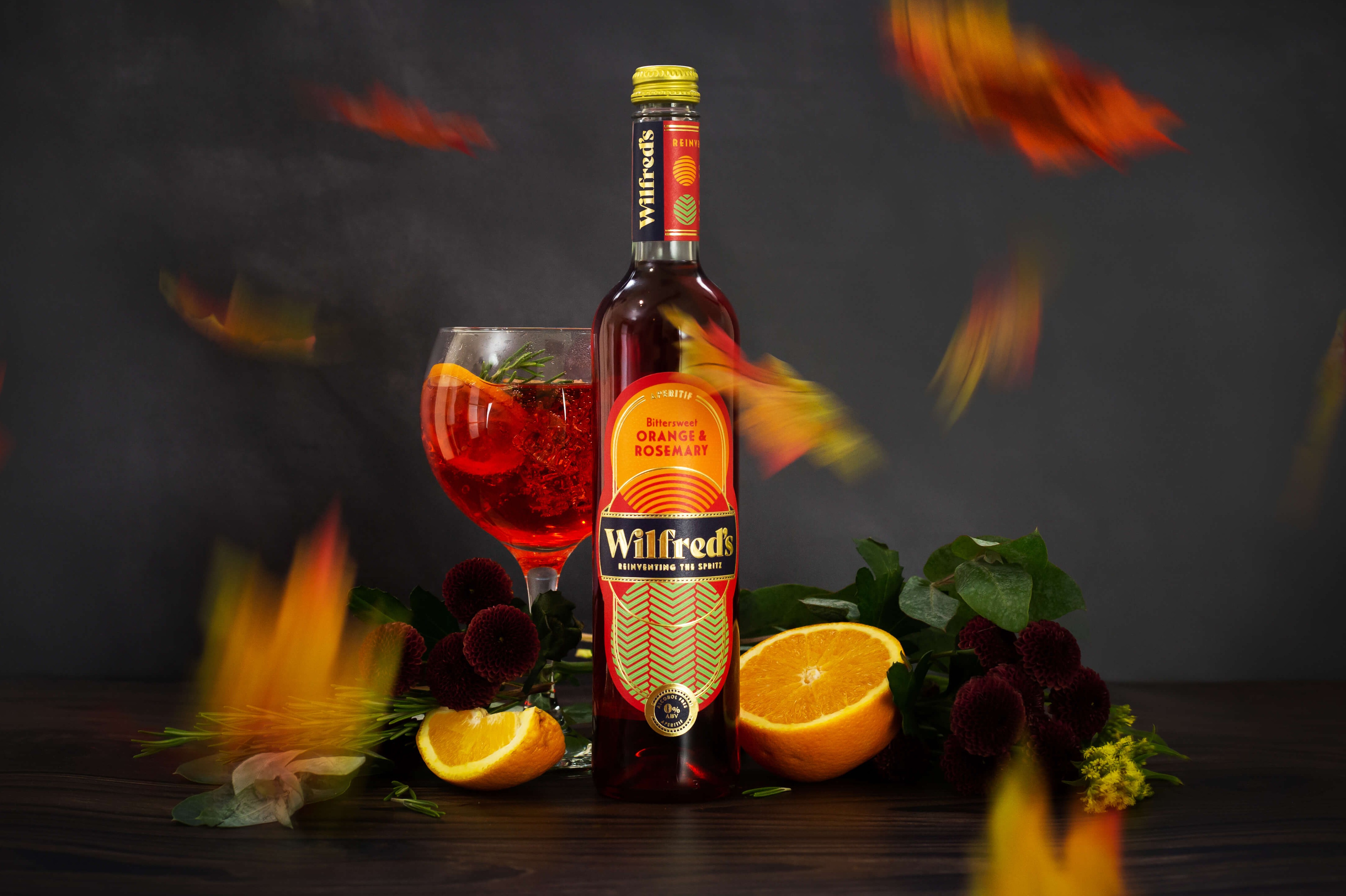 Alcohol free aperitif Bottle of alcohol free aperitif with autumnal leaves falling in the foreground